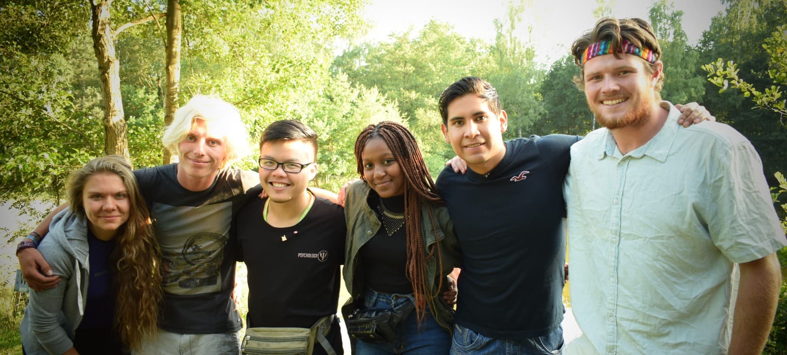 International camp counselors having fun with campers